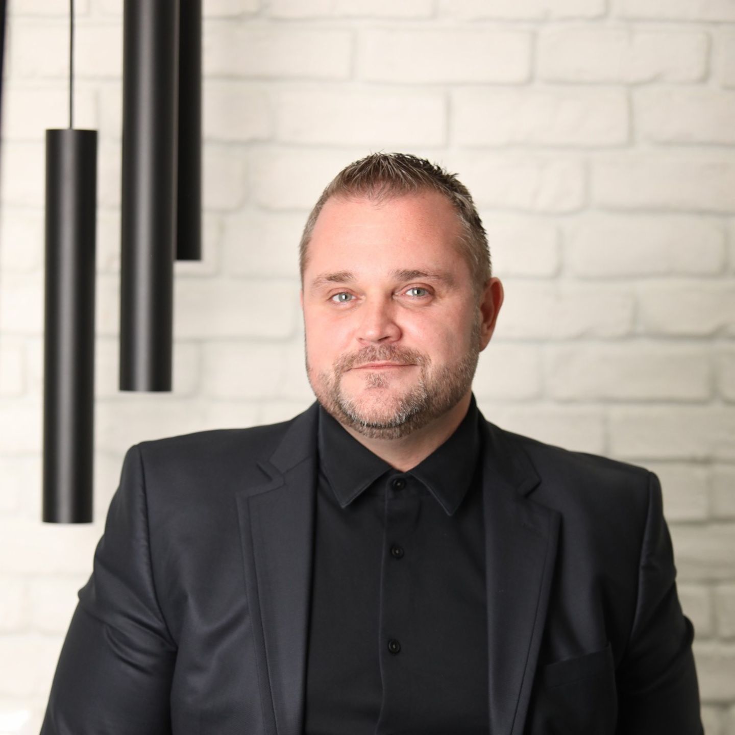 The image shows Emil Krastev, Deputy Managing Director at EOS in Bulgaria.